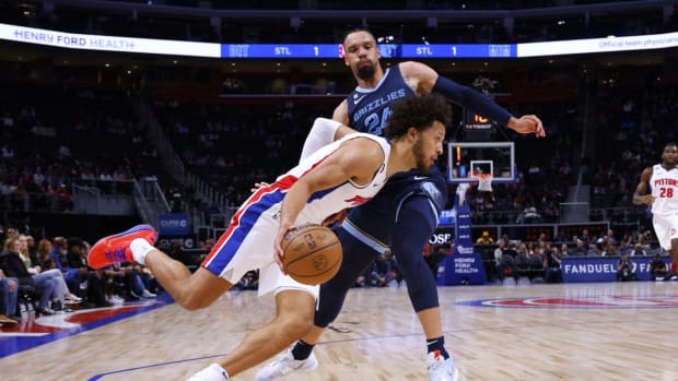 Oct 13, 2022; Detroit, Michigan, USA; Detroit Pistons guard Cade Cunningham (2) dribbles by Memphis Grizzlies forward Dillon Brooks (24) in the first half t Little Caesars Arena. Mandatory Credit: Rick Osentoski-USA TODAY Sports